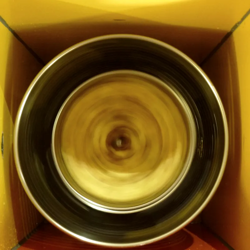 Centrifuge drum spinning at high speed with cassava chips inside